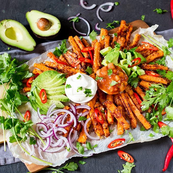 A lighter alternative to those crisps and dips - try my loaded Mexican-style carrot fries! A great party food, snack or lunch. Vegetarian and gluten free!