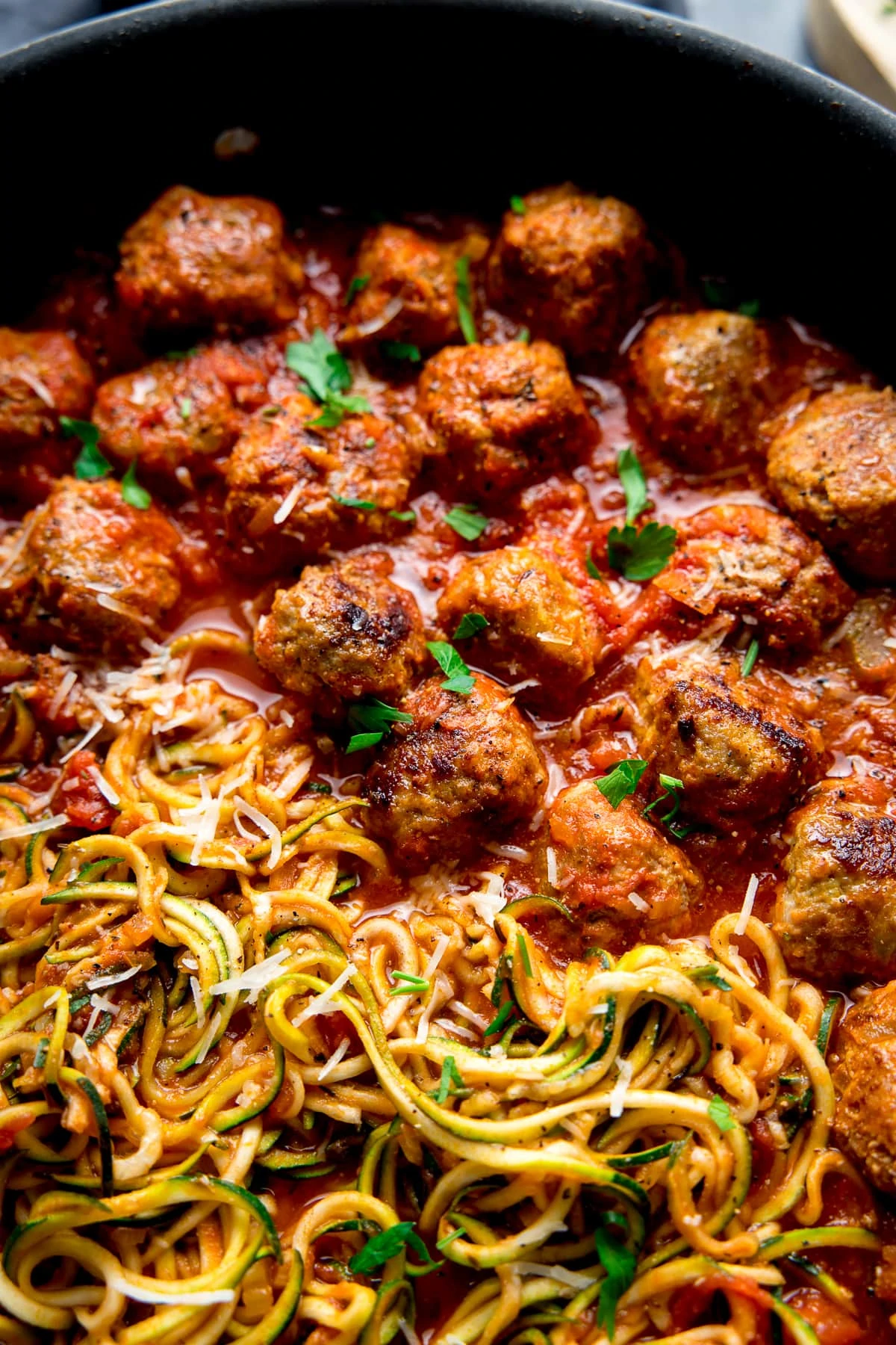 Close up image of Turkey meatballs and courgetti in a pan