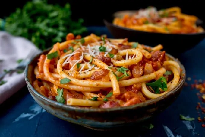 Close up side photo of Amatriciana pasta in a bowl