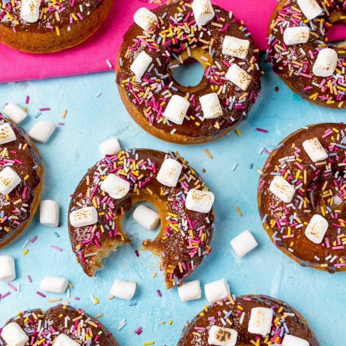 Chocolate Baked S'mores Doughnuts - quick and easy doughnuts with chocolate ganache, marshmallows and lots of sprinkles! Great for a bakesale!