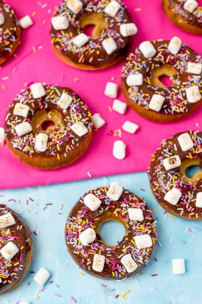 Chocolate Baked S'mores Doughnuts - quick and easy doughnuts with chocolate ganache, marshmallows and lots of sprinkles! Great for a bakesale!