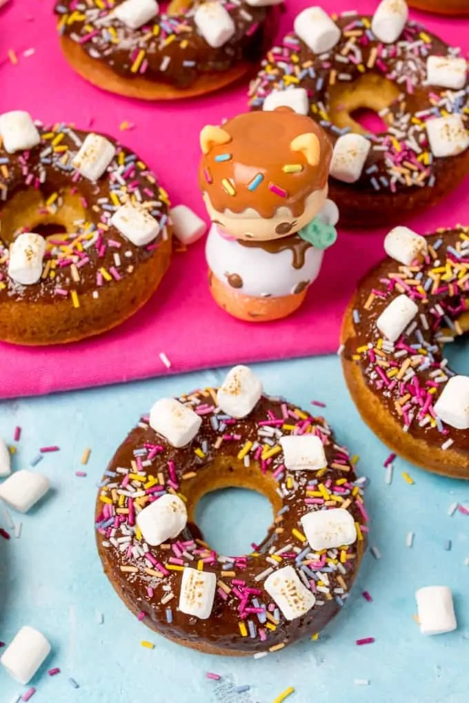 Chocolate Baked S'mores Doughnuts - quick and easy doughnuts with chocolate ganache, marshmallows and lots of sprinkles! Great for a bakesale!