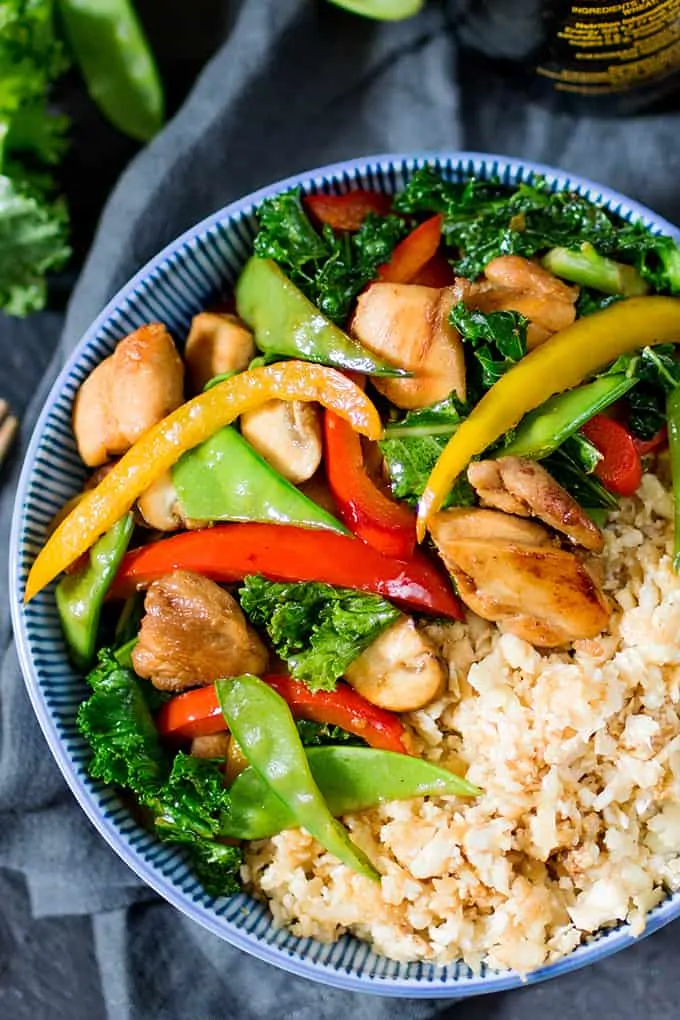 That Chinese take-away might be tempting, but this Honey and Garlic Chicken Stir Fry with Cauliflower Egg Fried Rice is just as tasty, and so much better for you!