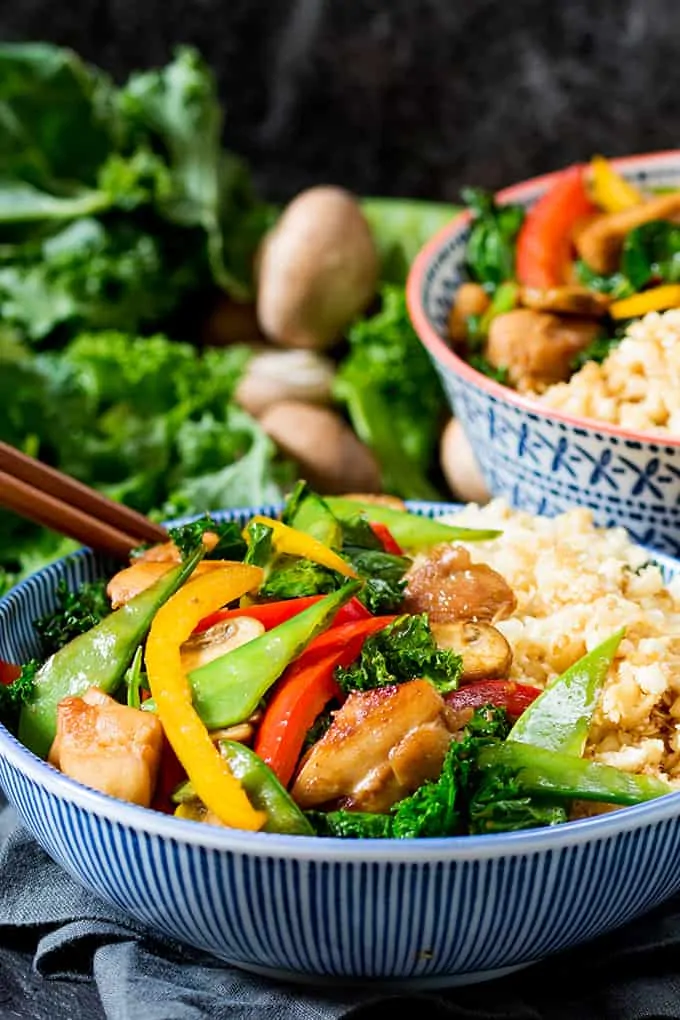 That Chinese take-away might be tempting, but this Honey and Garlic Chicken Stir Fry with Cauliflower Egg Fried Rice is just as tasty, and so much better for you!