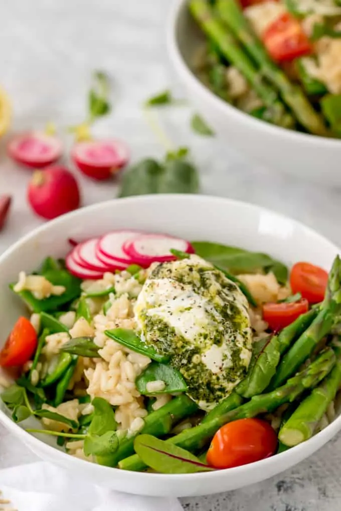 This Spring Vegetable Risotto with Creamy Pesto is creamy, cheesy and totally moreish! A fab gluten free and vegetarian dinner!