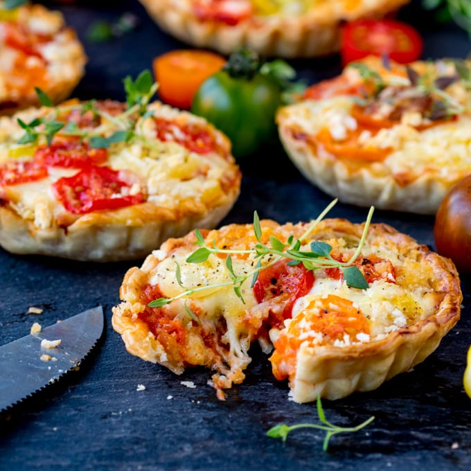 Cheese and Tomato Tarts with a rich tomato ragu and creamy béchamel sauce encased in shortcrust pastry. The best vegetarian lunch!