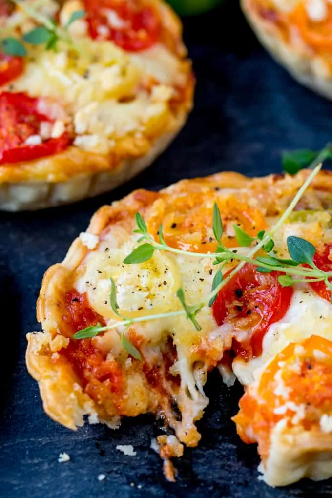 Cheese and Tomato Tarts with a rich tomato ragu and creamy béchamel sauce encased in shortcrust pastry. The best vegetarian lunch!