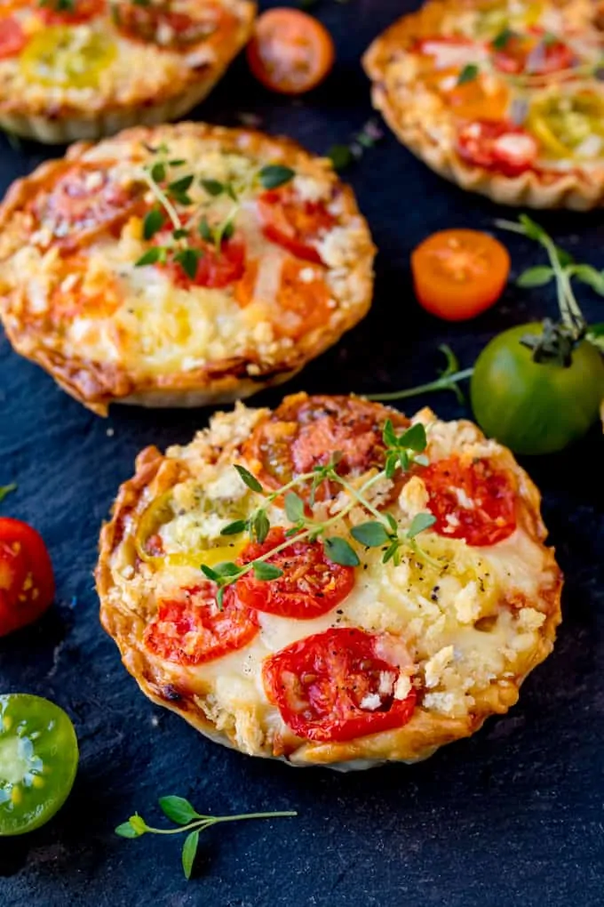 Cheese and Tomato Tarts with a rich tomato ragu and creamy béchamel sauce encased in shortcrust pastry. The best vegetarian lunch!