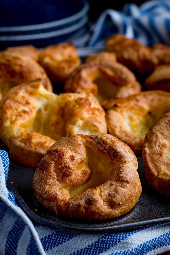 Close up of yorkshire puddings in a tin