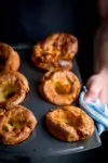 Hands holding a tin of yorkshire puddings