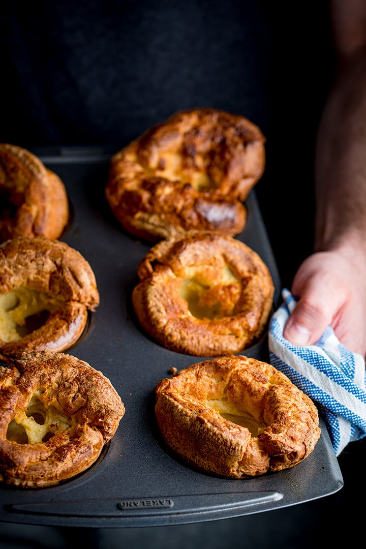 Hands holding a tin of yorkshire puddings
