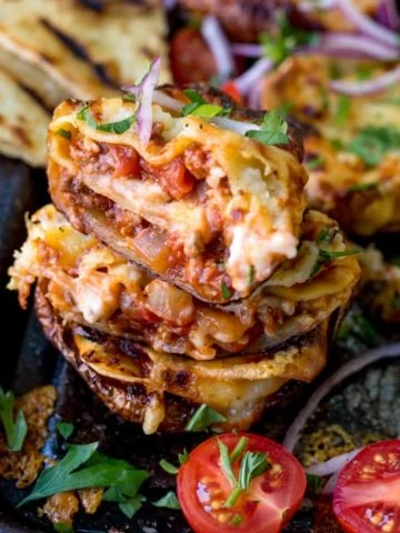 Lasagne Potato Skins - yep, this carb-fest is a winning dinner! This recipe makes a 8 potato skins PLUS a four-person lasagne to save for later.