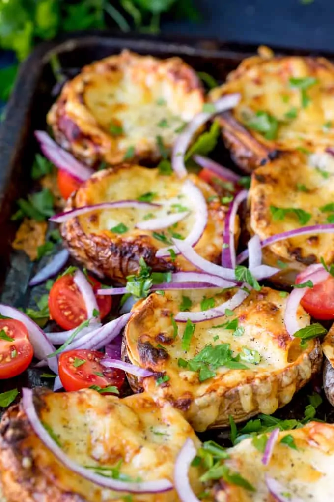 Lasagne Potato Skins - yep, this carb-fest is a winning dinner! This recipe makes a 8 potato skins PLUS a four-person lasagne to save for later.