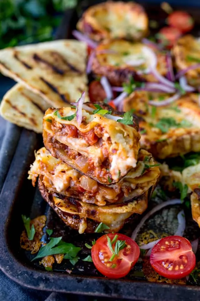 Lasagne Potato Skins - yep, this carb-fest is a winning dinner! This recipe makes a 8 potato skins PLUS a four-person lasagne to save for later.