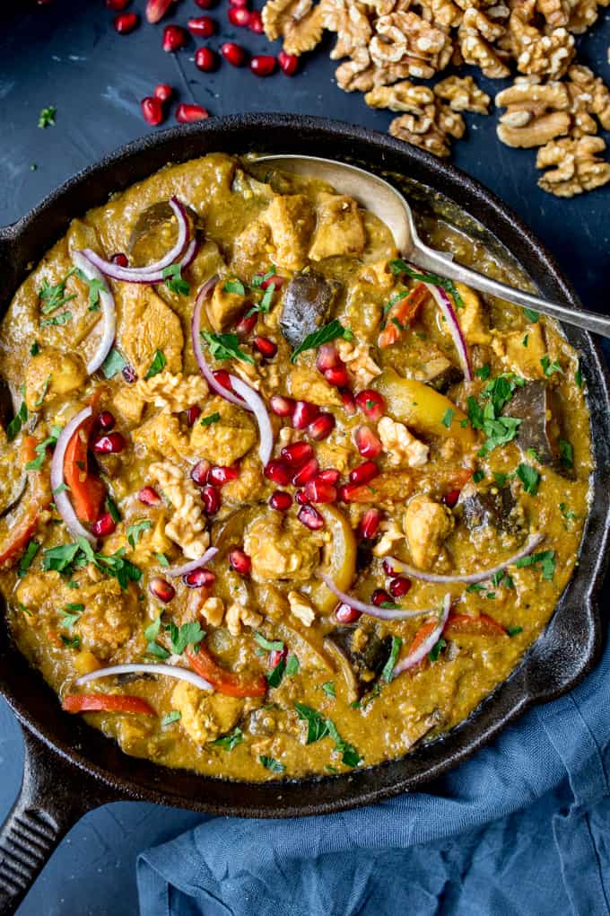 Overhead close photo of Persian Style Chicken Curry With Walnuts and Pomegranate