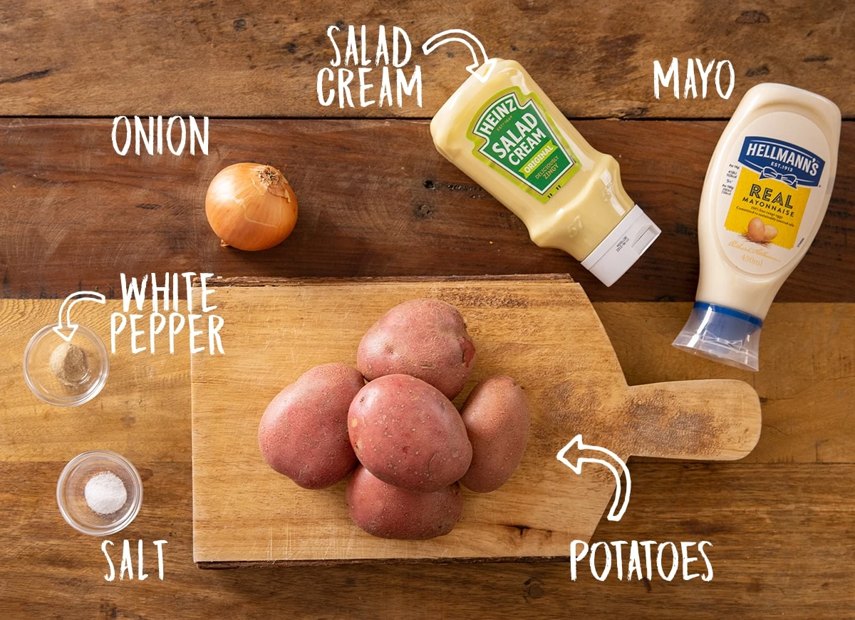 Ingredients for potato salad on a wooden table