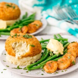 These Saucy Fish Co. Fishcakes with Cheesy Mash and Crispy Garlic Prawns make a great weeknight dinner when you're in a rush, but still want something really tasty!