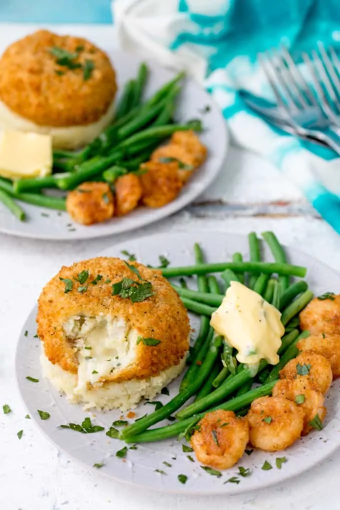 These Saucy Fish Co. Fishcakes with Cheesy Mash and Crispy Garlic Prawns make a great weeknight dinner when you're in a rush, but still want something really tasty!