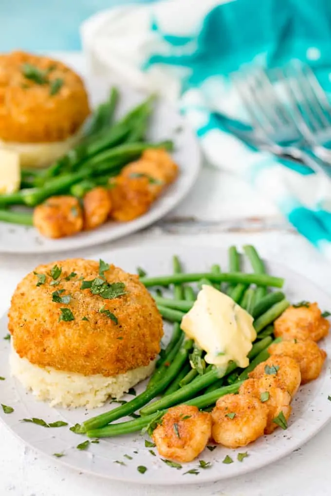 These Saucy Fish Co. Fishcakes with Cheesy Mash and Crispy Garlic Prawns make a great weeknight dinner when you're in a rush, but still want something really tasty!