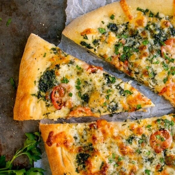 Homemade Cheese and Tomato Garlic Pizza Bread - a crisp dough with that perfect chewy interior, loaded with garlic, tomatoes and two types of cheese!