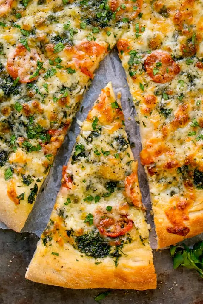 Homemade Cheese and Tomato Garlic Pizza Bread - a crisp dough with that perfect chewy interior, loaded with garlic, tomatoes and two types of cheese!