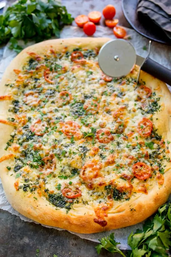 Homemade Cheese and Tomato Garlic Pizza Bread - a crisp dough with that perfect chewy interior, loaded with garlic, tomatoes and two types of cheese!