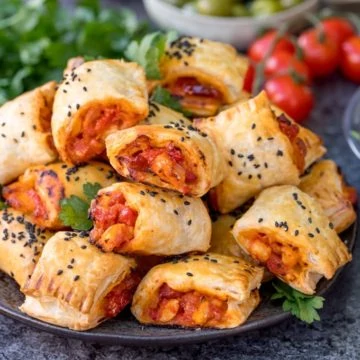 Chicken Chorizo Puff Pastry Rolls - This easy snack uses leftover pasta sauce. Have spaghetti for dinner, and these pastry rolls for lunch the next day!