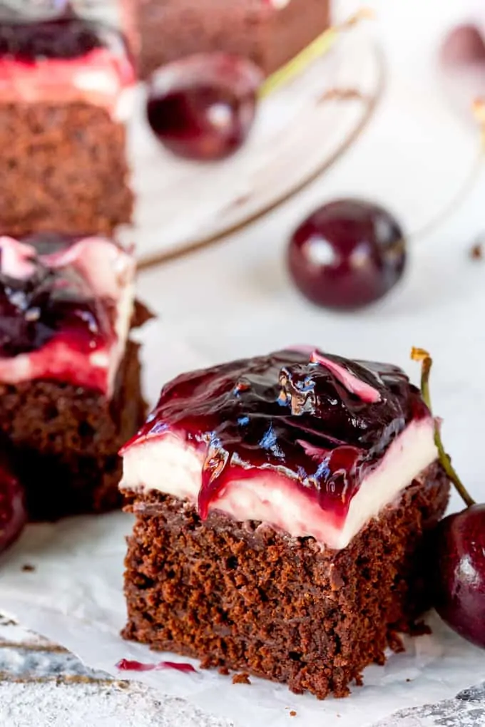 Hooray for two desserts in one with these Chocolate Cherry Cheesecake Brownies! Easily made gluten free! A brilliant party dessert!