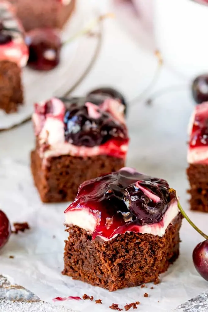 Hooray for two desserts in one with these Chocolate Cherry Cheesecake Brownies! Easily made gluten free! A brilliant party dessert!