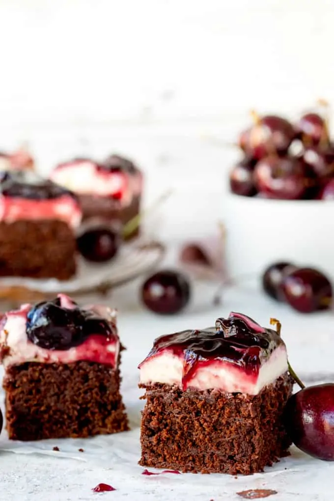 Hooray for two desserts in one with these Chocolate Cherry Cheesecake Brownies! Easily made gluten free! A brilliant party dessert!