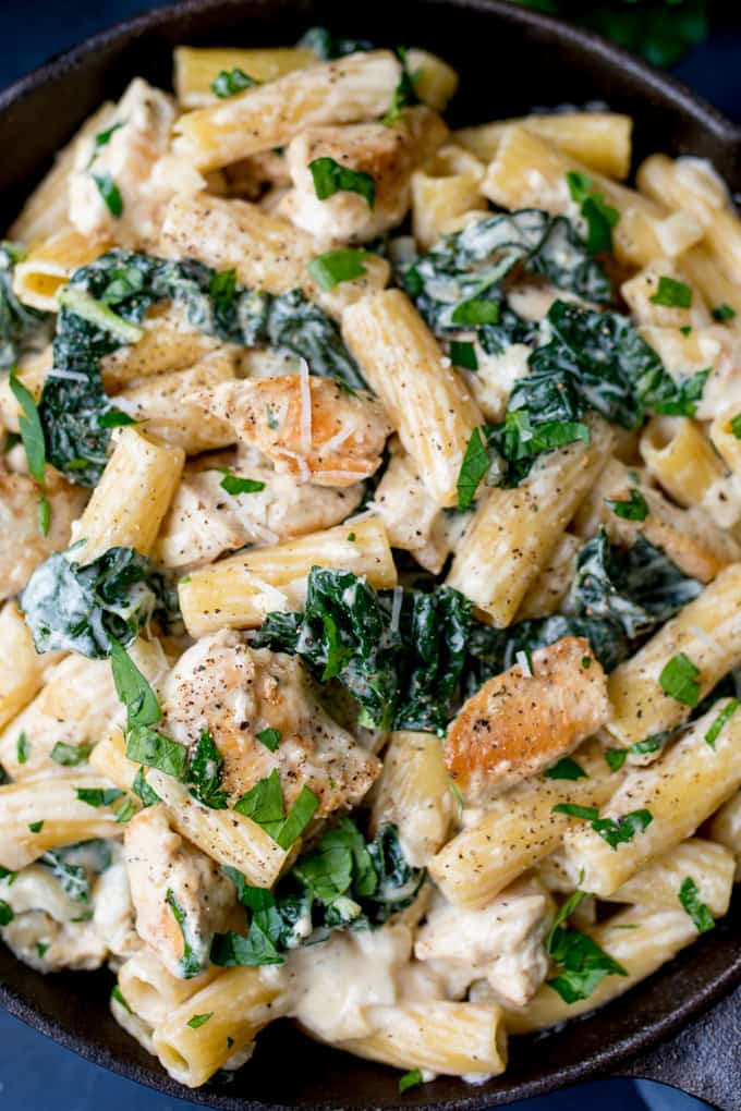 Close up overhead photo of One Pot Rigatoni Alfredo with Chicken and Kale in a creamy, rich, garlic and parmesan sauce