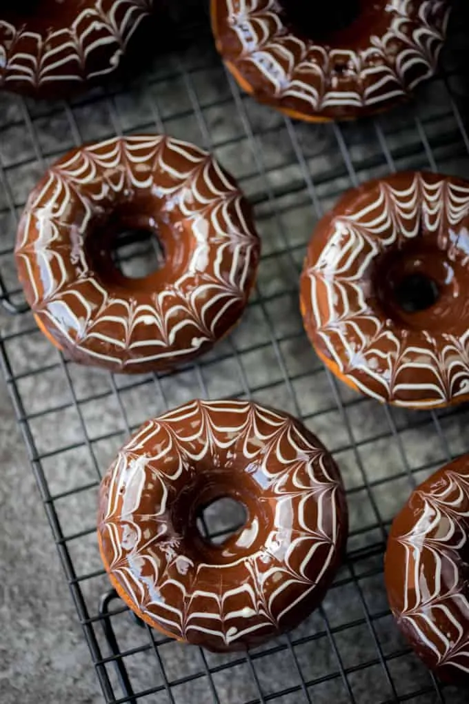 These baked Halloween Spider Web Doughnuts are easy to make and look fab on your party table!