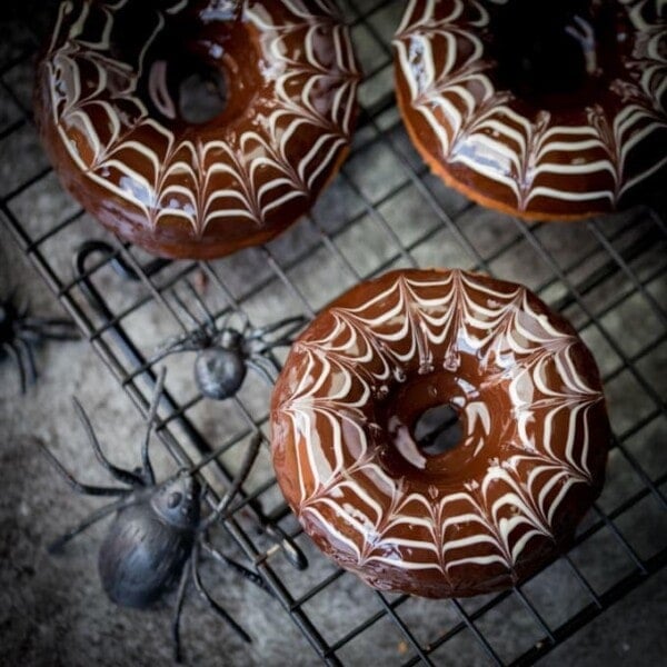 These baked Halloween Spider Web Doughnuts are easy to make and look fab on your party table!