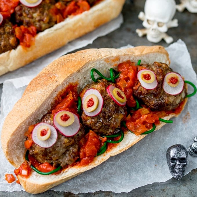 Juicy meatballs in a yummy tomato-based sauce - this Halloween Eyeball Sub is spooky and it makes a delicious dinner! The kids will love it!