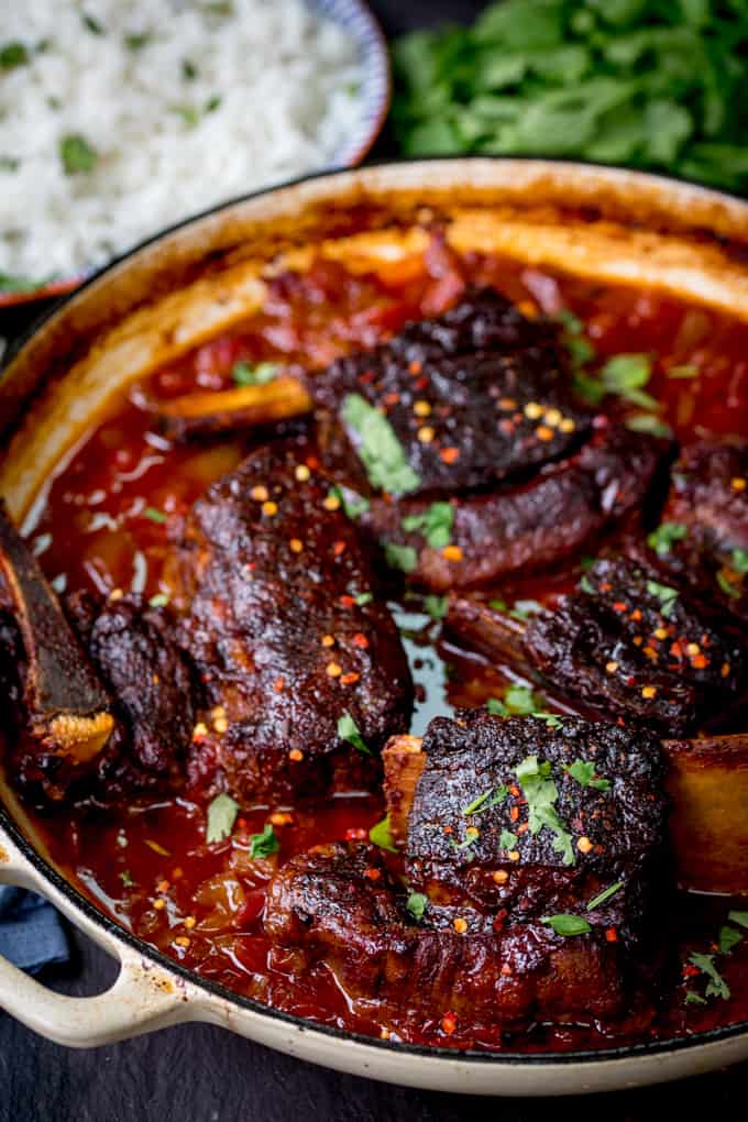 Caramelized Slow Roast Asian Beef Short Ribs in a cast iron pan