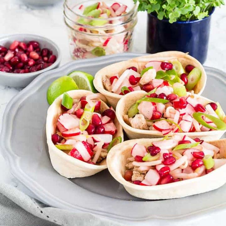 Turkey tacos with radishes on a light background