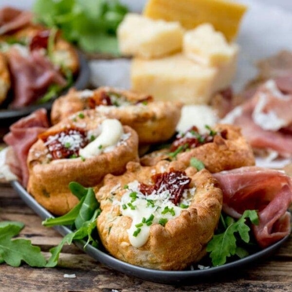 No longer a side dish, make Yorkshire Puddings the main event with these herby Yorkshire puddings, filled with cheesy béchamel and sunblush tomatoes!