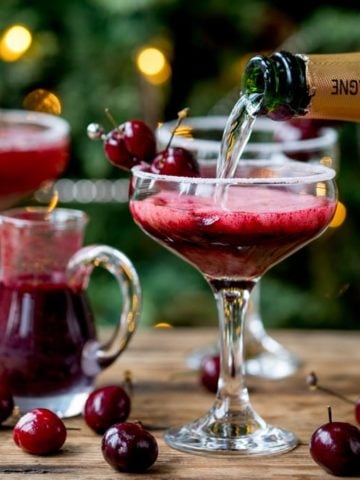 New Year's Eve Cocktail? Make the fruit puree ahead of time for this Black Cherry Bellini cocktail so you can serve up them up in super-quick time!