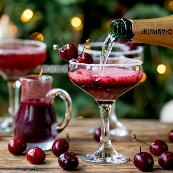 New Year's Eve Cocktail? Make the fruit puree ahead of time for this Black Cherry Bellini cocktail so you can serve up them up in super-quick time!