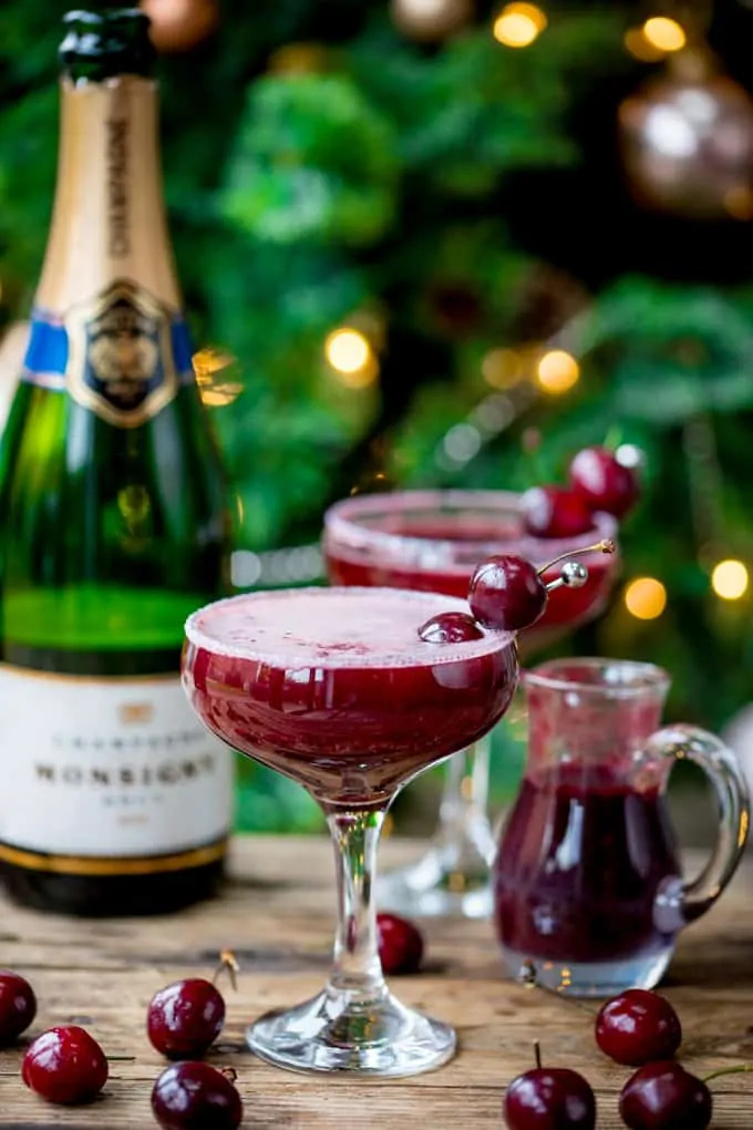 New Year's Eve Cocktail? Make the fruit puree ahead of time for this Black Cherry Bellini cocktail so you can serve up them up in super-quick time!