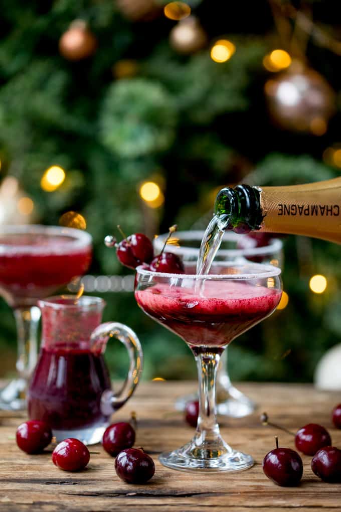 New Year's Eve Cocktail? Make the fruit puree ahead of time for this Black Cherry Bellini cocktail so you can serve up them up in super-quick time!