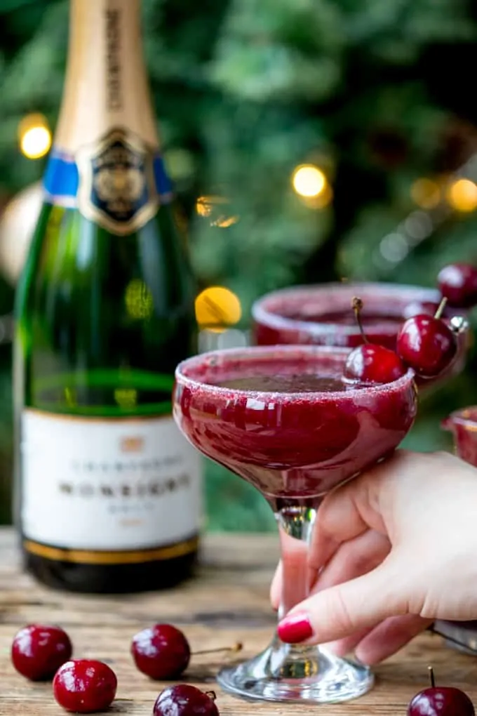 New Year's Eve Cocktail? Make the fruit puree ahead of time for this Black Cherry Bellini cocktail so you can serve up them up in super-quick time!