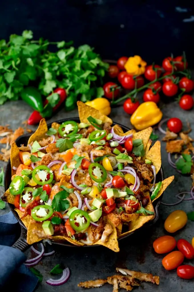 What should you do with all that leftover turkey....Make these Crispy Turkey Nachos!! Crispy fajita-spiced turkey, beans, and a ton of melted cheese!!!