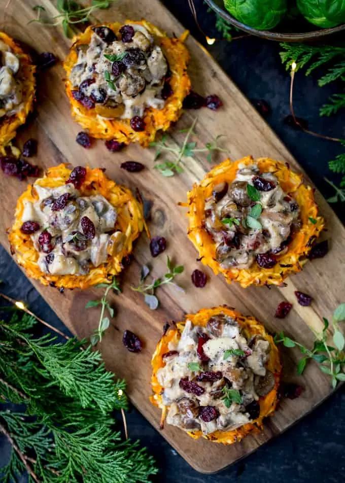 Overhead Photos of Parsnip and Carrot Rostis with Mushrooms and Wensleydale Sauce on a wooden board