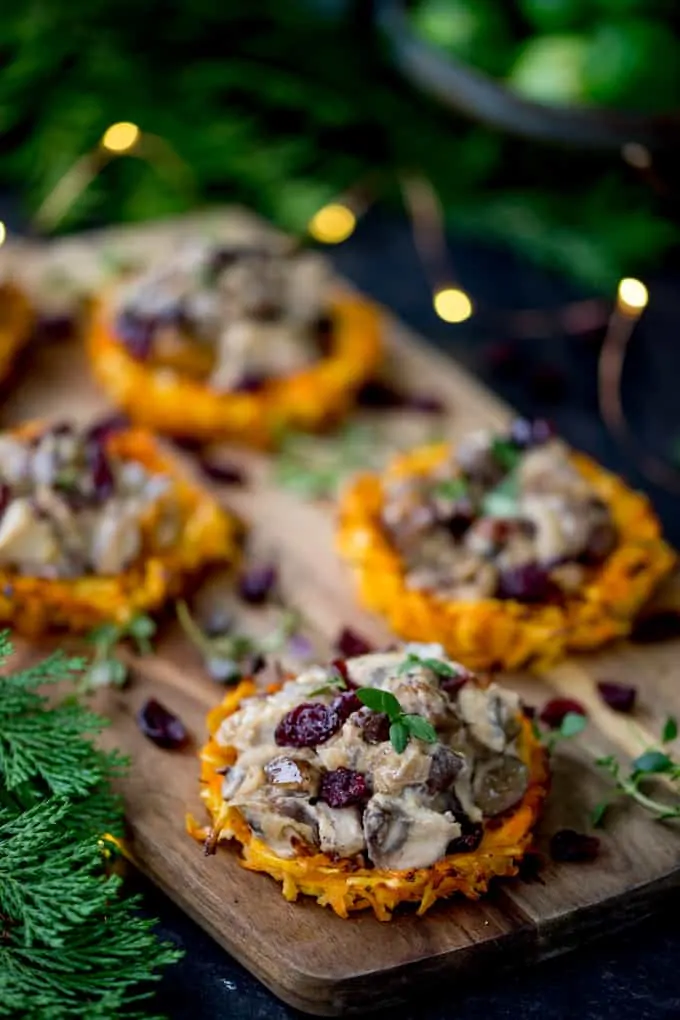 Parsnip and Carrot Rostis with Mushrooms and Wensleydale Sauce on a wooden board