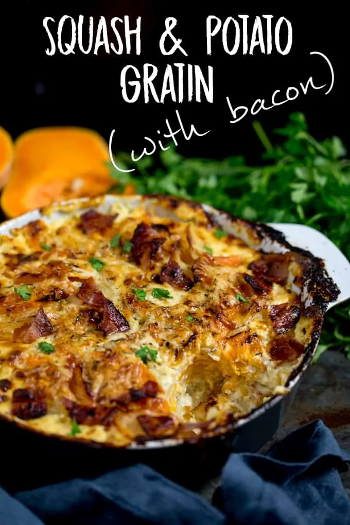 Squash and Potato Gratin in a grey and white backing dish with a scoop taken out, topped with bacon