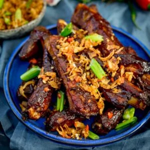 How about theseĀ Oven Baked Asian Ribs with Crispy Onions for Chinese New Year? Slow cooked in the oven until tender, then brushed with a sticky marinade and finished with crispy onions!