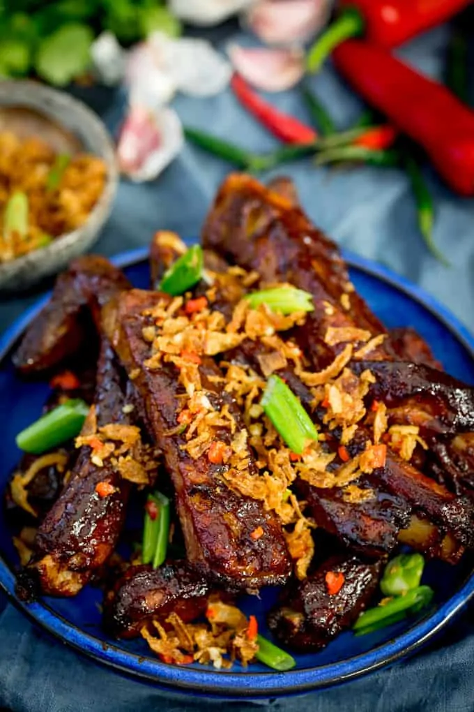 Oven Baked Asian Ribs with Crispy Onions on a blue plate