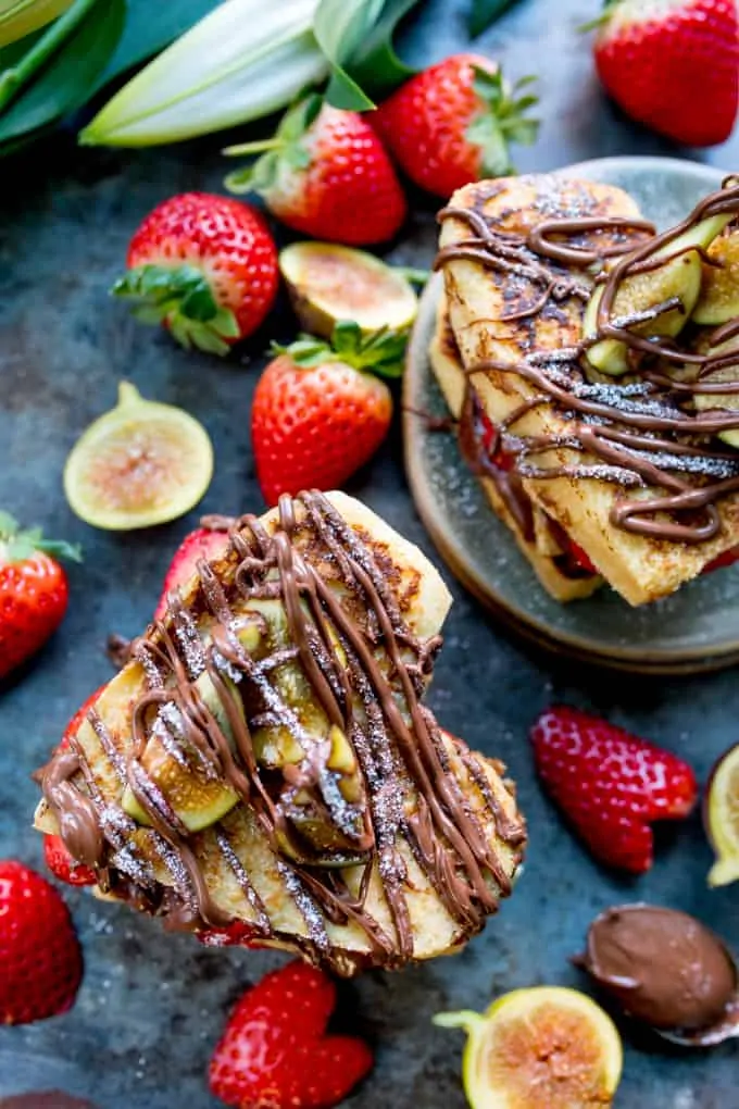 Overhead photo of valentines French Toast Hearts with nutella drizzled on