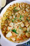 This Creamy Chicken and Potato Bake with extra veggies is a whole meal in one dish! Kind of like a creamy chicken, carrot and spinach casserole, topped with potato gratin! #potatogratin #onepotmeal #creamychicken #chickencasserole